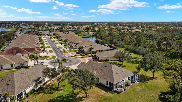 bird's eye view with a water view and a residential view