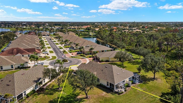 bird's eye view featuring a water view and a residential view