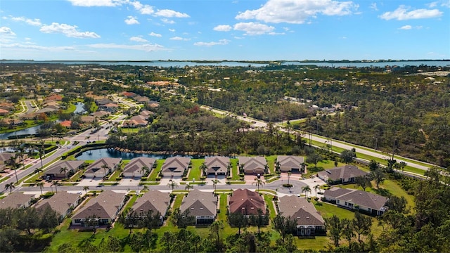 aerial view featuring a water view and a residential view