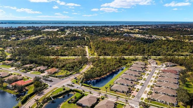 bird's eye view featuring a water view and a residential view