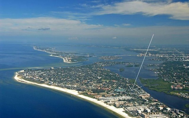 bird's eye view with a water view and a beach view