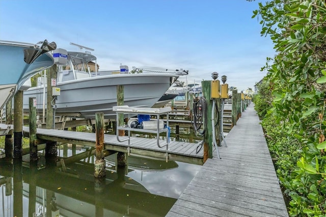 view of dock featuring a water view and boat lift