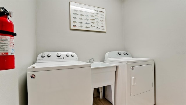 laundry area with independent washer and dryer