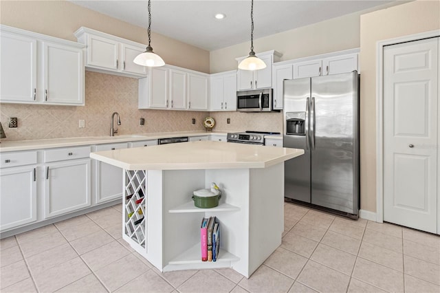 kitchen featuring appliances with stainless steel finishes, white cabinets, light countertops, and open shelves