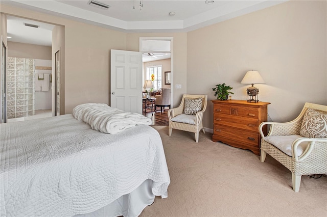 bedroom with visible vents and light carpet