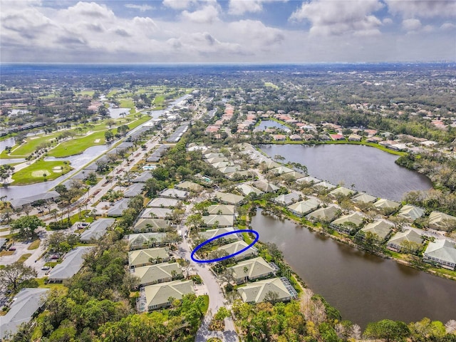 bird's eye view featuring a water view and a residential view