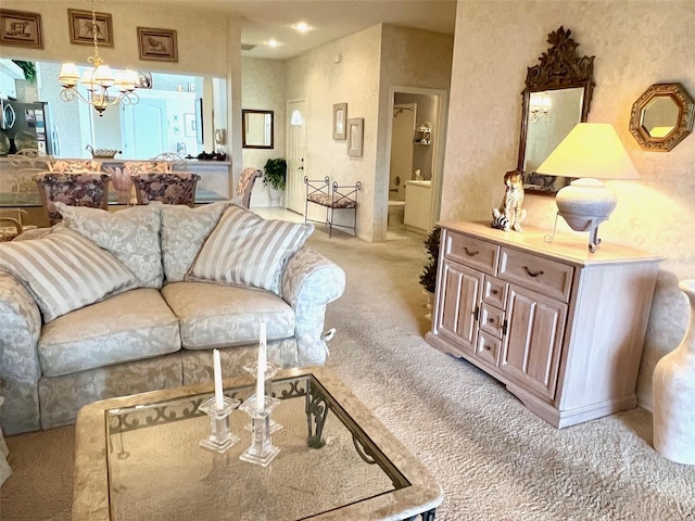 living area featuring a notable chandelier and light colored carpet