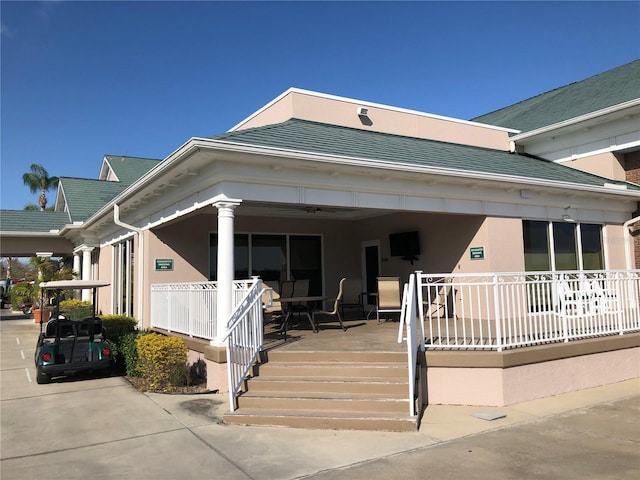 view of front of home with a porch and stucco siding