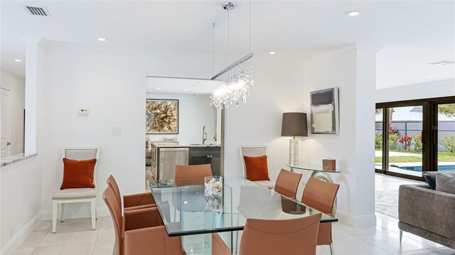 526 Bird Key Dr, Sarasota, FL 34236 - dining room with tile patterned flooring, ornamental molding, recessed lighting, baseboards, and a chandelier