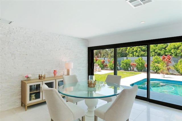 526 Bird Key Dr, Sarasota, FL 34236 - dining space featuring light tile patterned floors