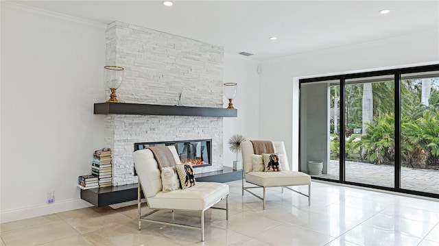 526 Bird Key Dr, Sarasota, FL 34236 - sitting room with a fireplace, tile patterned flooring, recessed lighting, crown molding, and baseboards