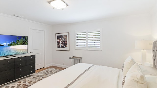 526 Bird Key Dr, Sarasota, FL 34236 - bedroom with light wood-style floors, baseboards, and ornamental molding