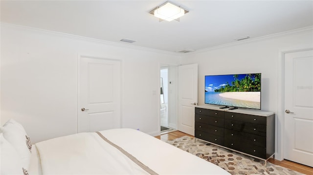 526 Bird Key Dr, Sarasota, FL 34236 - bedroom featuring light wood-style flooring and ornamental molding