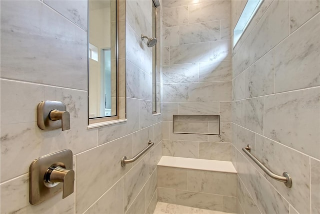 bathroom with tiled shower