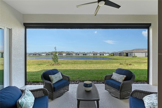 view of patio / terrace featuring ceiling fan and a residential view