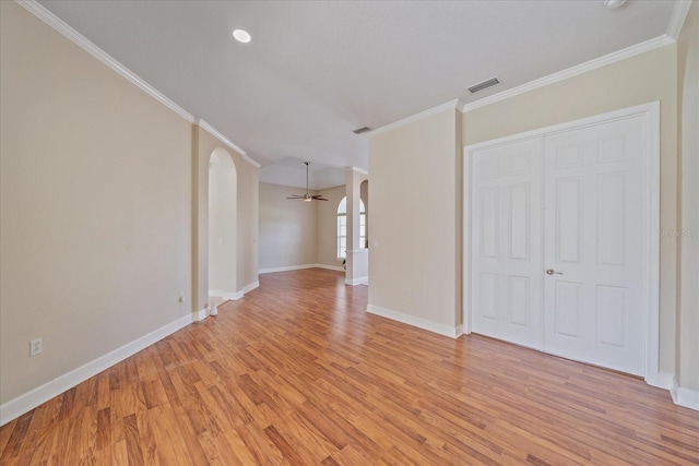 unfurnished living room with ceiling fan, light hardwood / wood-style flooring, and crown molding