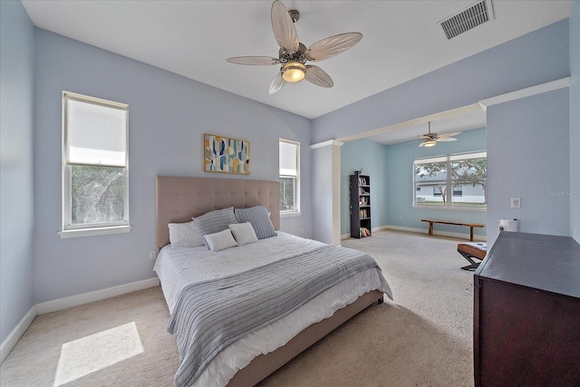 bedroom featuring ceiling fan and light colored carpet