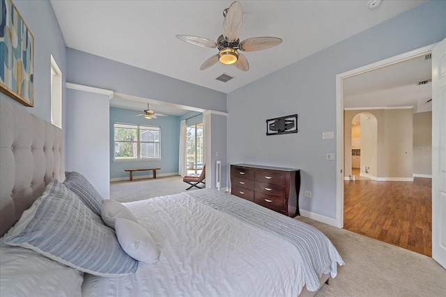 bedroom with ceiling fan and light colored carpet