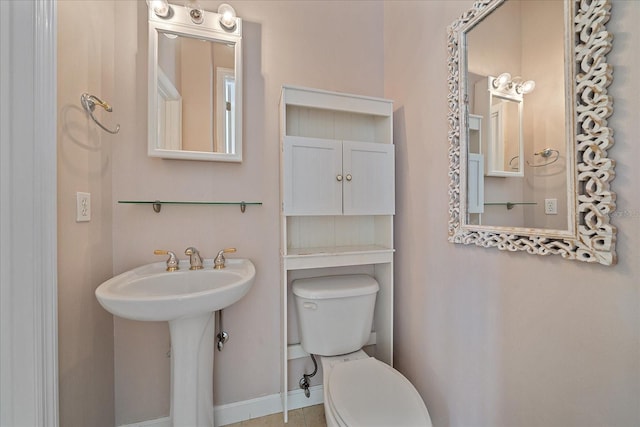 bathroom featuring sink and toilet