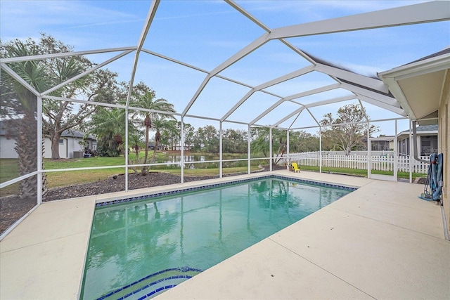 view of swimming pool with a lanai, a lawn, and a patio area