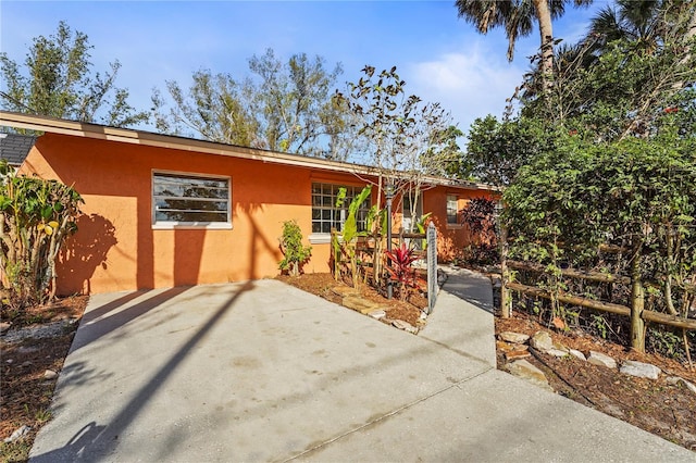 rear view of property with stucco siding