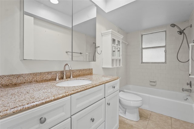 full bath with tile patterned flooring, tub / shower combination, vanity, and toilet