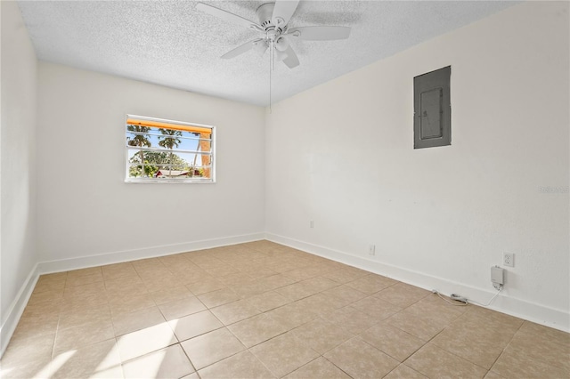 empty room featuring a textured ceiling, baseboards, electric panel, and a ceiling fan