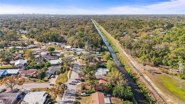 bird's eye view featuring a forest view and a residential view