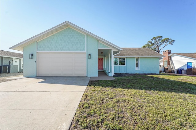 ranch-style house featuring a garage, concrete driveway, brick siding, and a front lawn