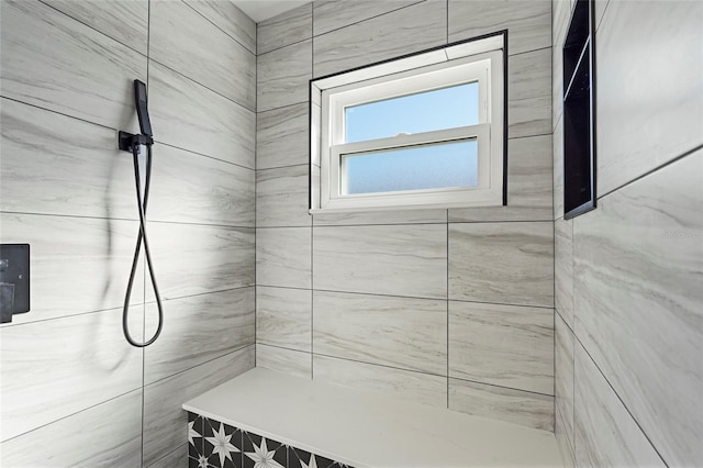 full bath featuring tiled shower