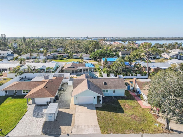 bird's eye view with a residential view and a water view