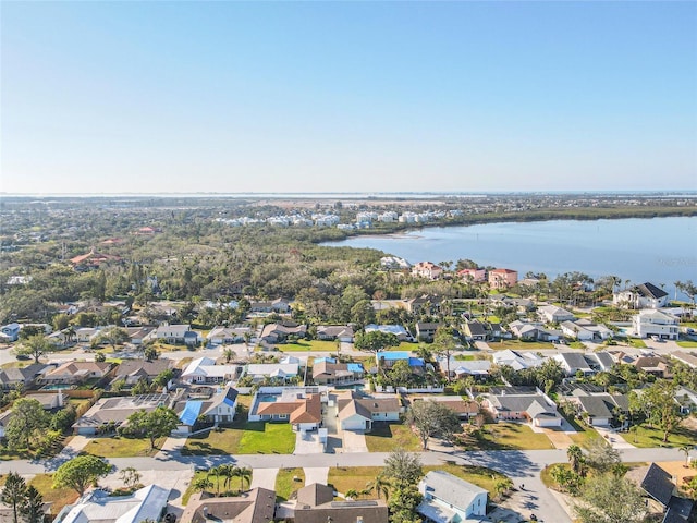 bird's eye view featuring a water view and a residential view