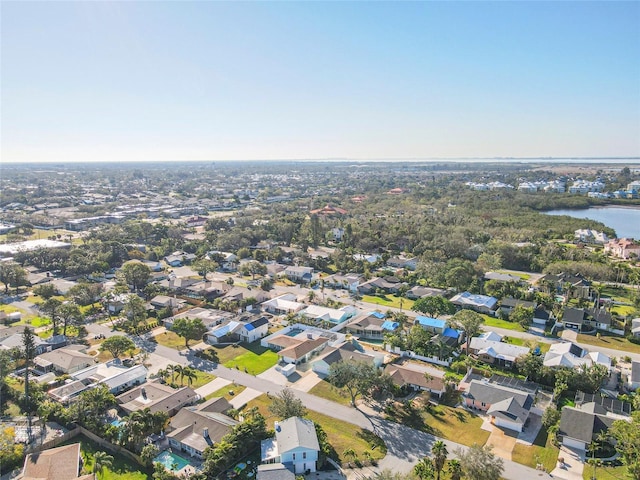 drone / aerial view with a residential view and a water view