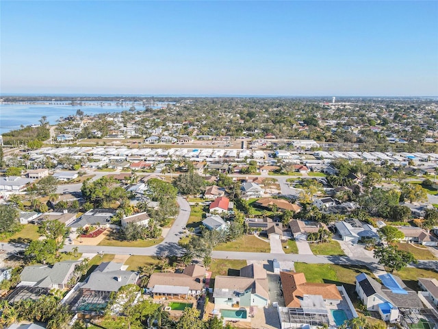 drone / aerial view featuring a water view and a residential view