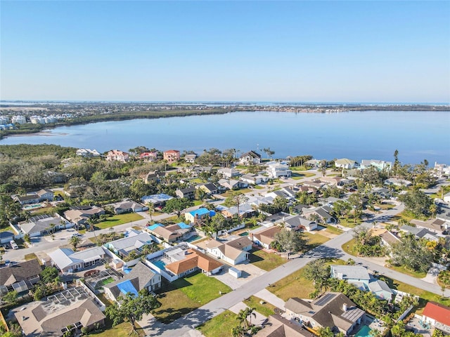 birds eye view of property featuring a residential view and a water view