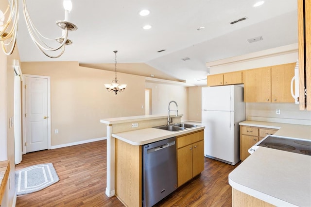 kitchen featuring a center island with sink, light countertops, stainless steel dishwasher, freestanding refrigerator, and a sink