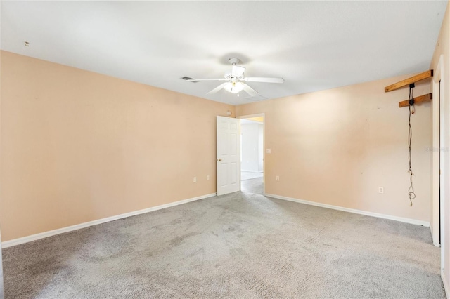 unfurnished room with a ceiling fan, carpet flooring, and baseboards