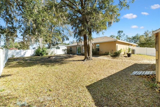 view of yard with a fenced backyard