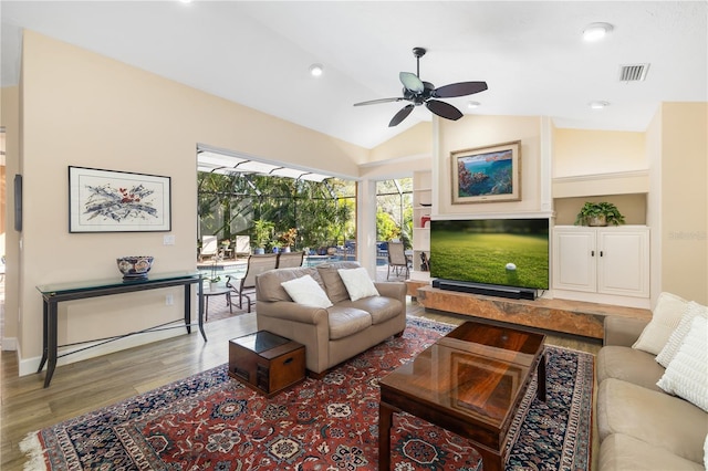 living room with visible vents, ceiling fan, vaulted ceiling, recessed lighting, and wood finished floors