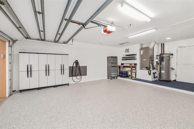 garage featuring a garage door opener and heat pump water heater