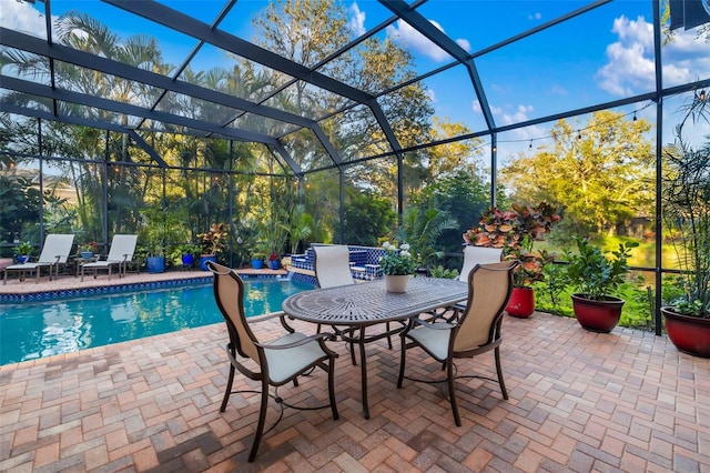 pool featuring a lanai and a patio area