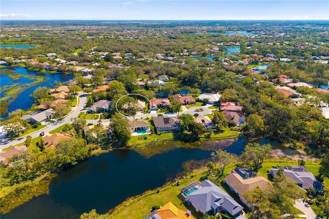 birds eye view of property with a residential view and a water view