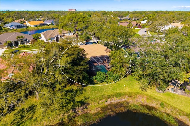 drone / aerial view featuring a residential view and a water view