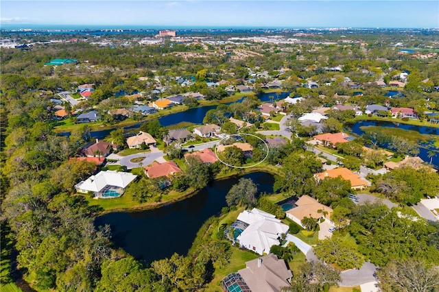 drone / aerial view with a residential view and a water view