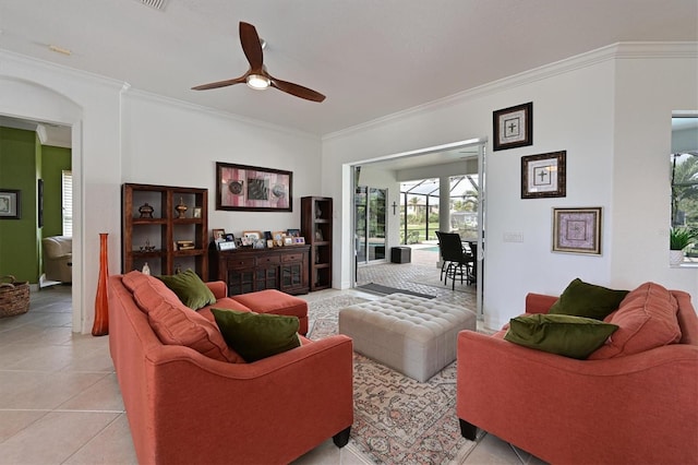 living area featuring ornamental molding, ceiling fan, and light tile patterned floors