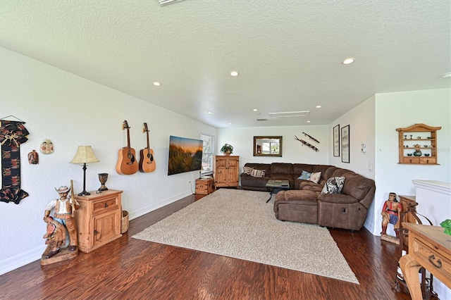 living room with dark wood-style floors, baseboards, a textured ceiling, and recessed lighting