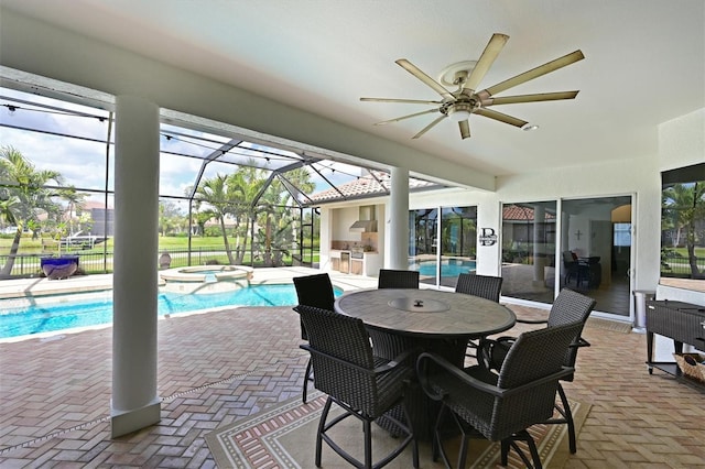 sunroom / solarium featuring ceiling fan and a swimming pool