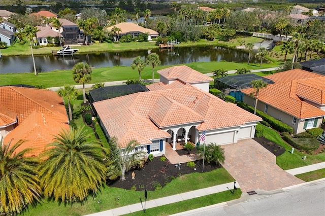 drone / aerial view with a water view and a residential view