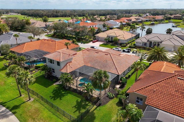 birds eye view of property featuring a water view and a residential view