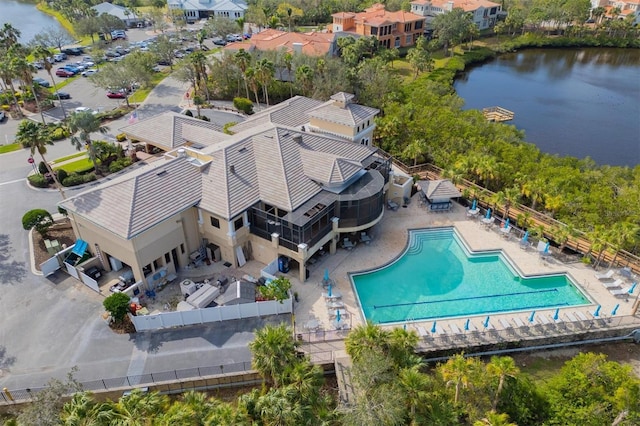 birds eye view of property with a water view and a residential view